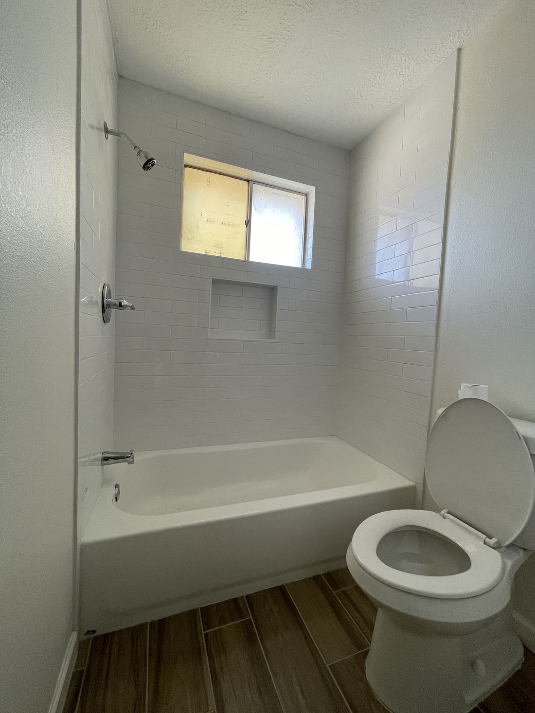 The finished bathroom with new tub surround and tile