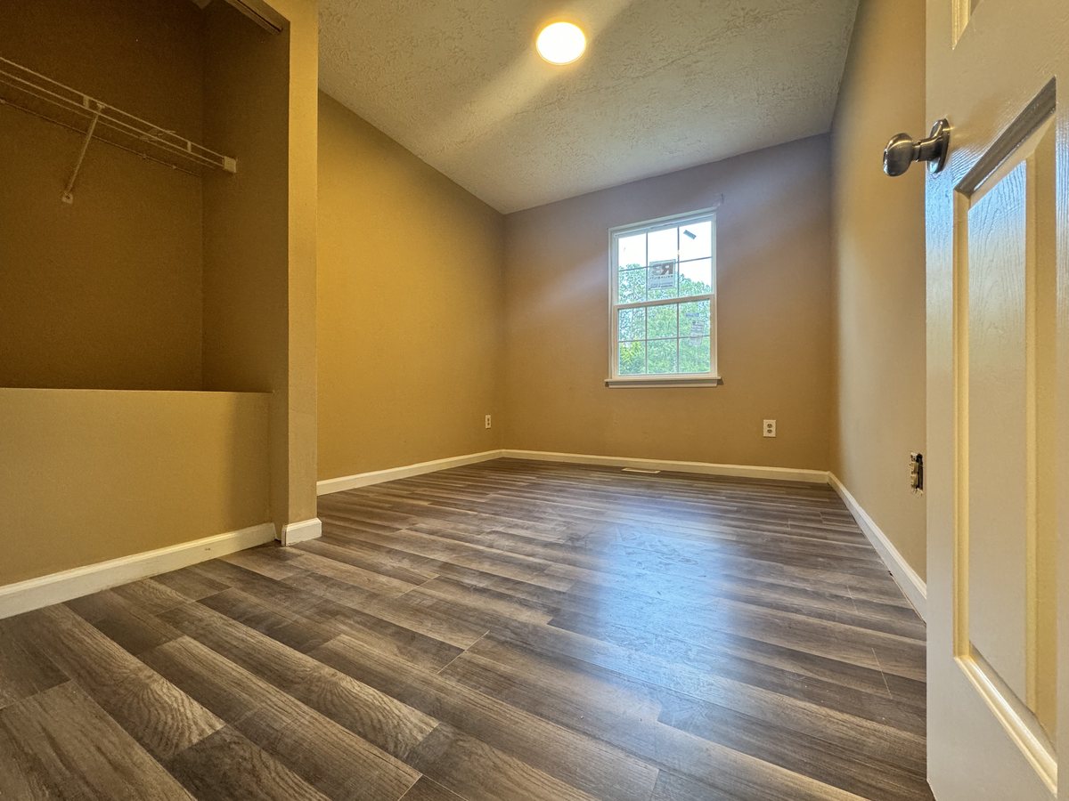 The same bedroom cleared, painted and refloored